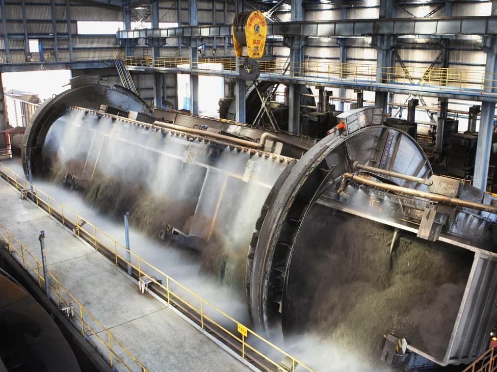 Large industrial processing equipment inside a metalworks facility